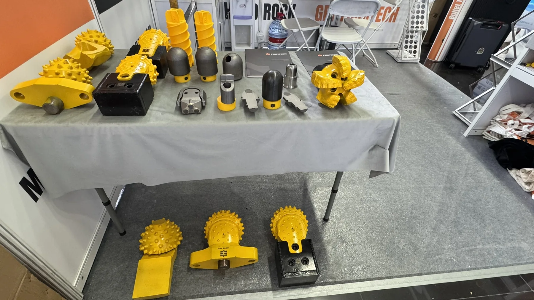 Roller bits and other drilling-tool samples on display.