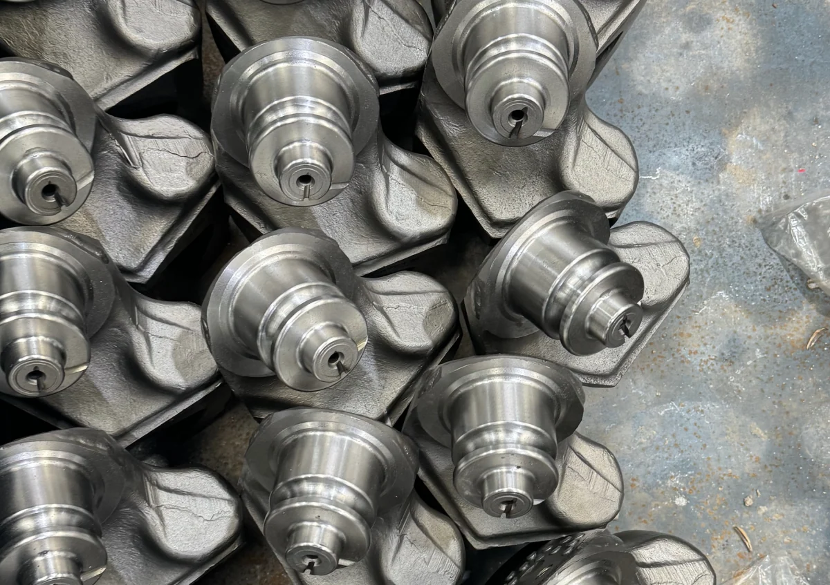 Finish-machined journals and bearing surfaces on roller-bit legs.