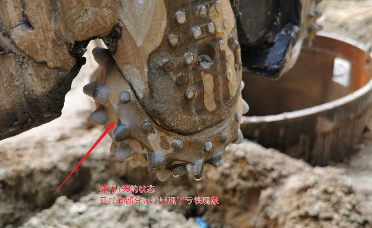 Later close-up, annotated as after one day. The arrow identifies steel loss around edge inserts.