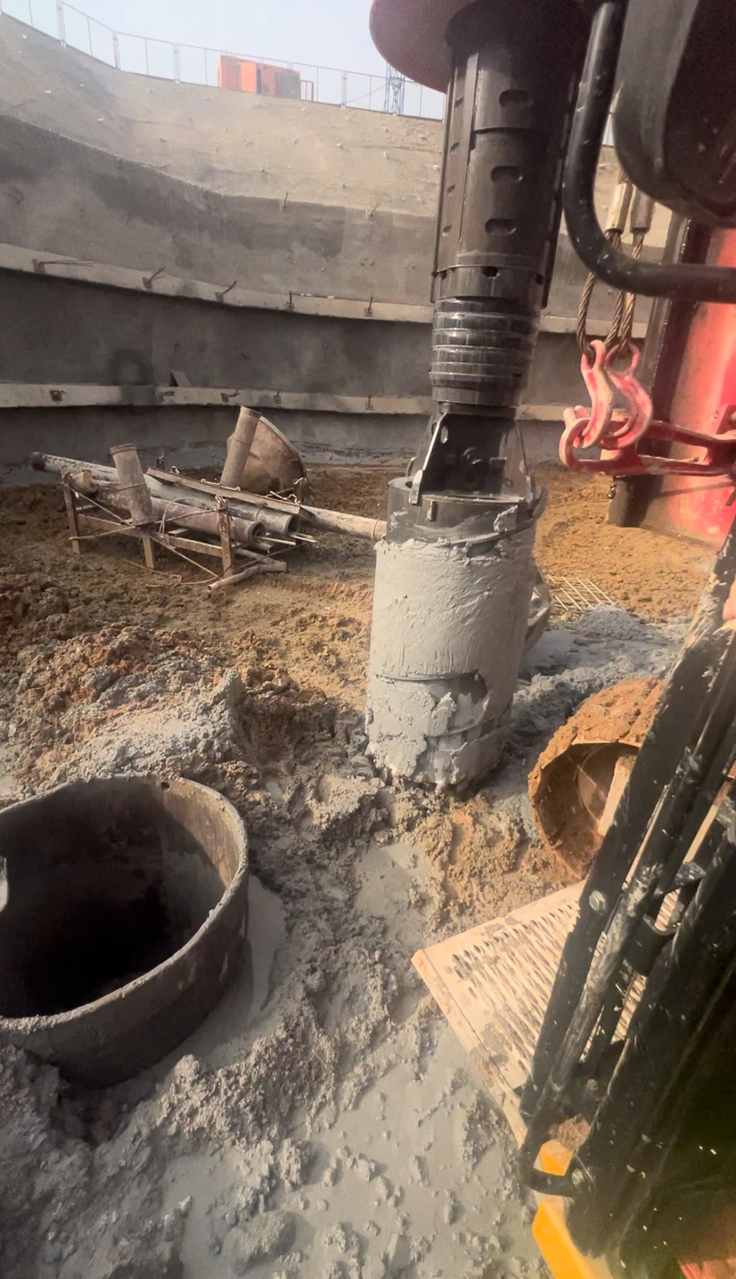 Bullet-tooth core barrel lifted beside the pile opening at the Guangdong site