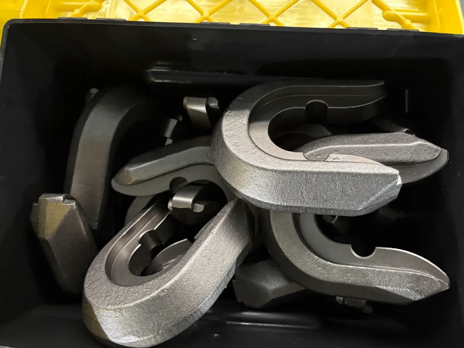 Separate WS39 holder components photographed in a parts container.