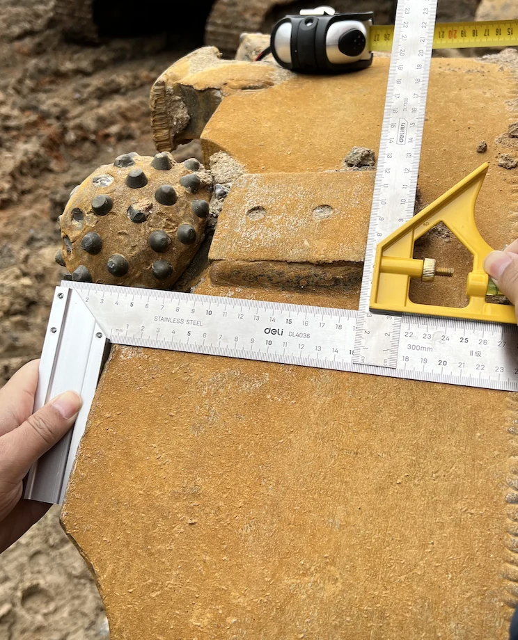 Ruler and square used beside a roller bit during the Hunan pre-rebuild survey of the customer’s barrel.